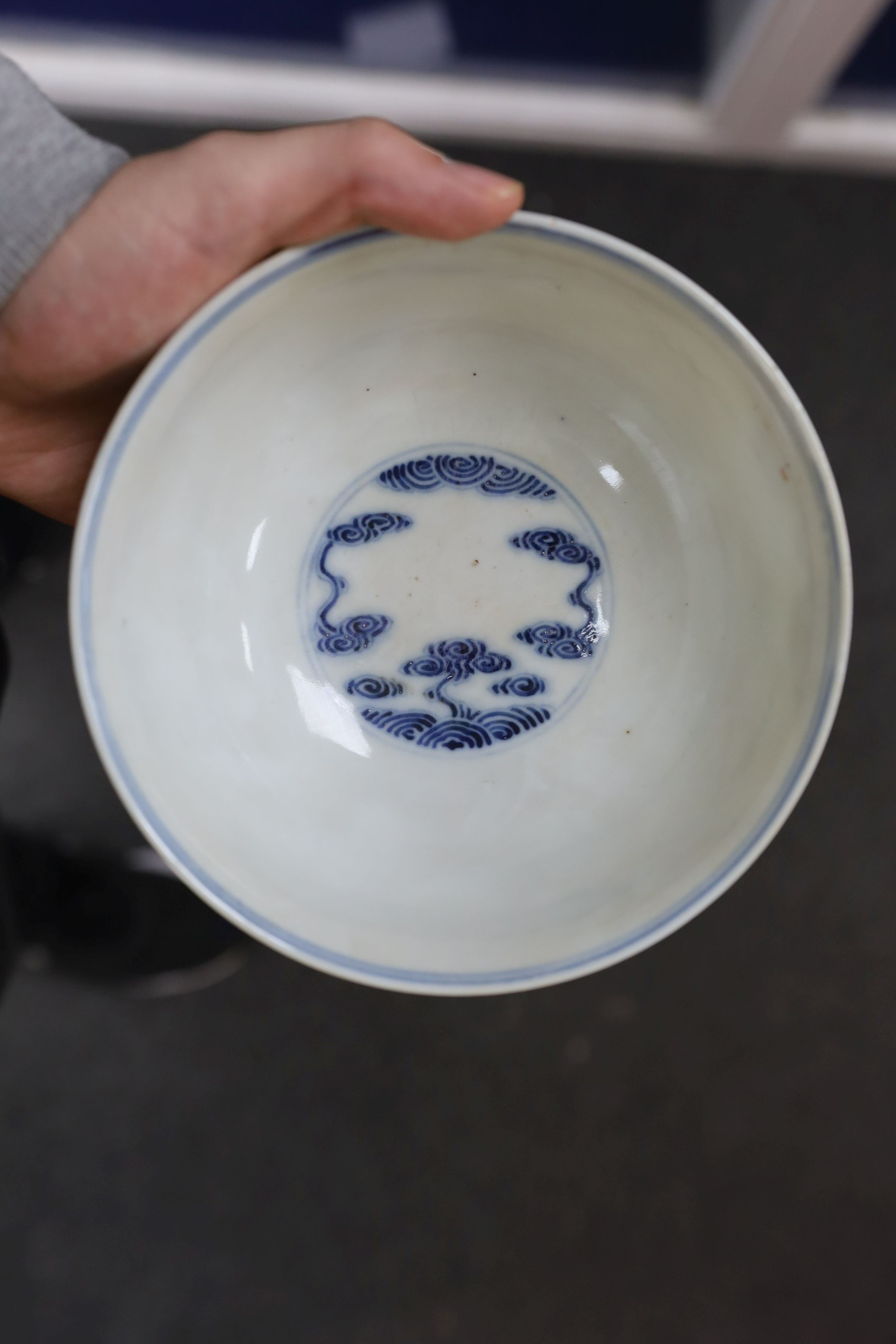 A pair of Chinese iron red and underglaze blue ‘five bat’ bowls, Guangxu mark and probably of the period (1875-1908), 16.5cm diameter